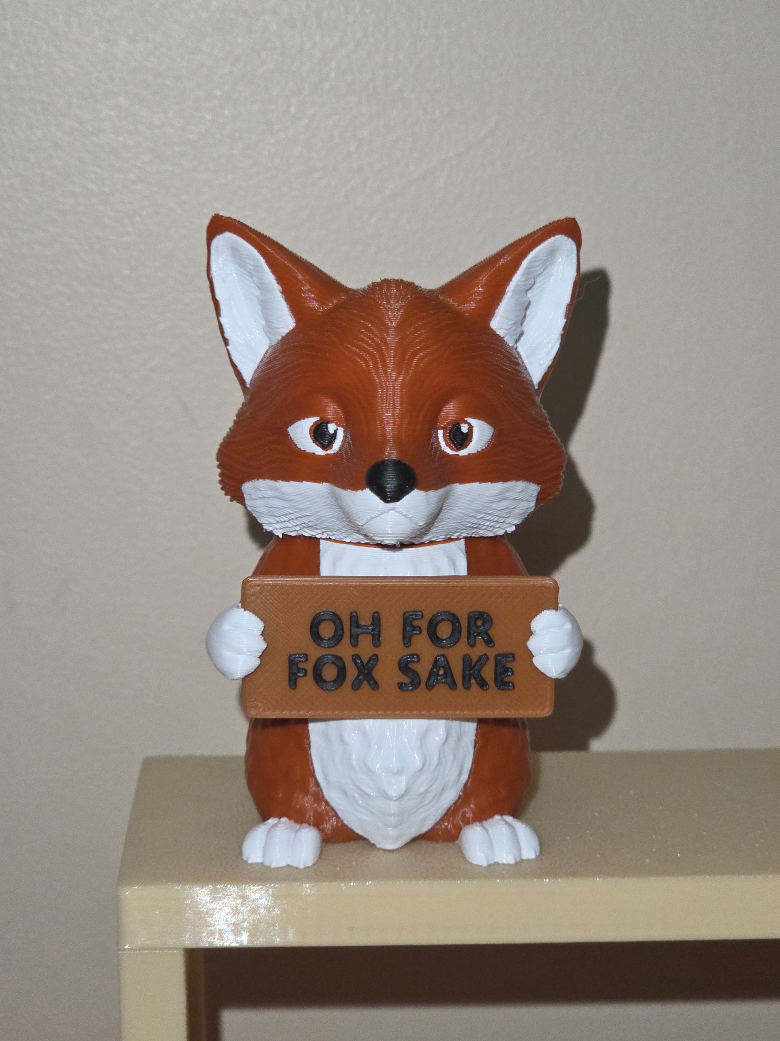 Fox holding a sign that says OH FOR FOX SAKE